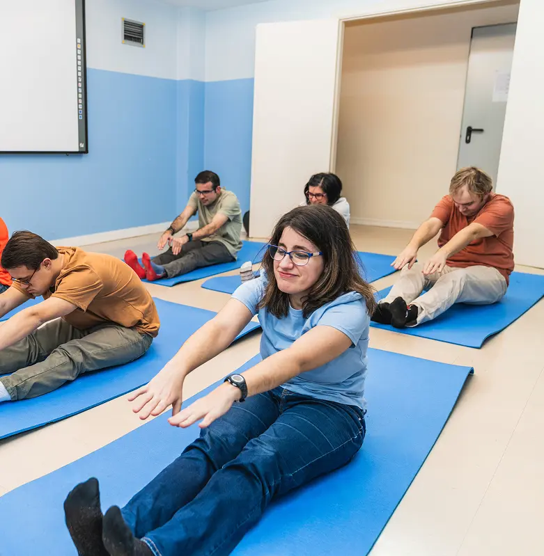 Group disability exercise and stretching class led for adults in a rehabilitation and wellness program at Healthstin Australia