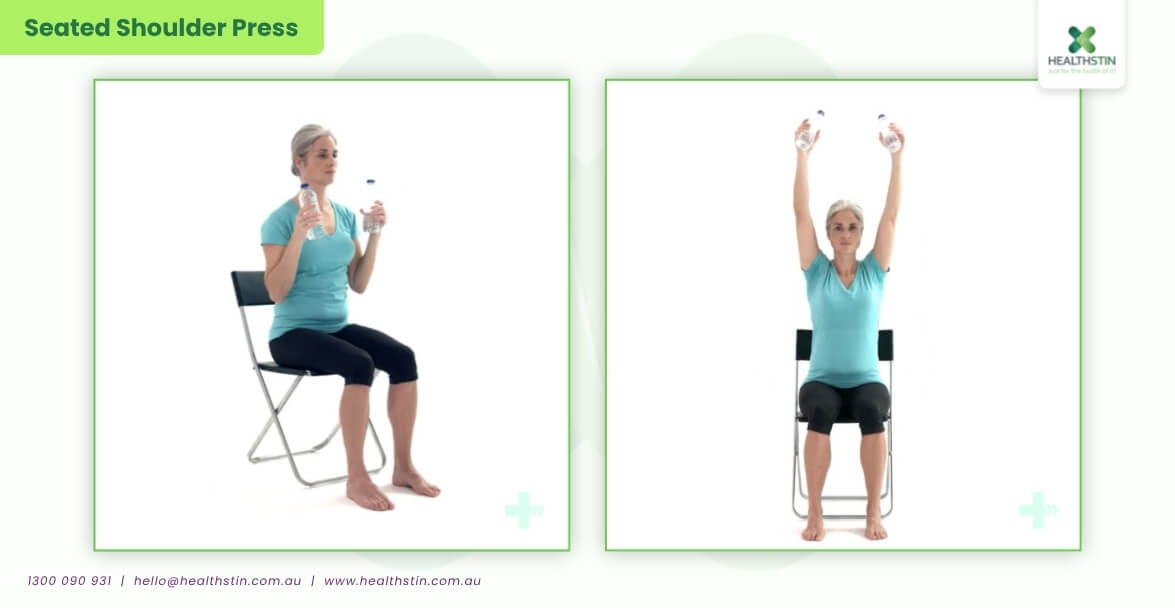 7 Best Exercises for Stroke Patients (Safe & Effective Recovery Guide) 27 Woman performing seated shoulder press exercises with light weights to improve shoulder strength, upper body mobility, posture, and rehabilitation recovery while seated at Healthstin.